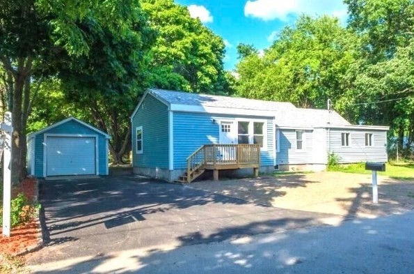 1 Chapel Lane Wareham, MA 02538 - Photo 4 of 29 a front view of a house with a yard