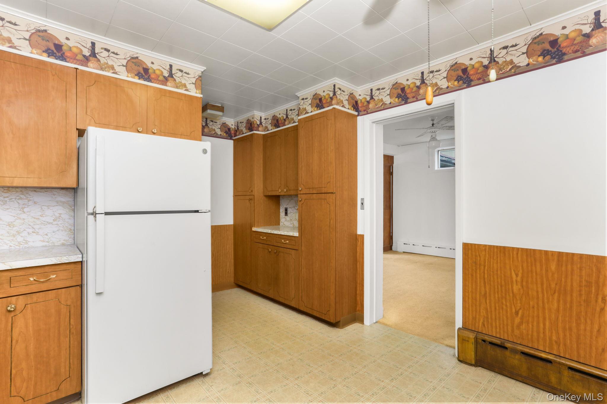 3 Hill Street New Rochelle, NY 10801 - Photo 11 of 46 a white refrigerator freezer and a microwave