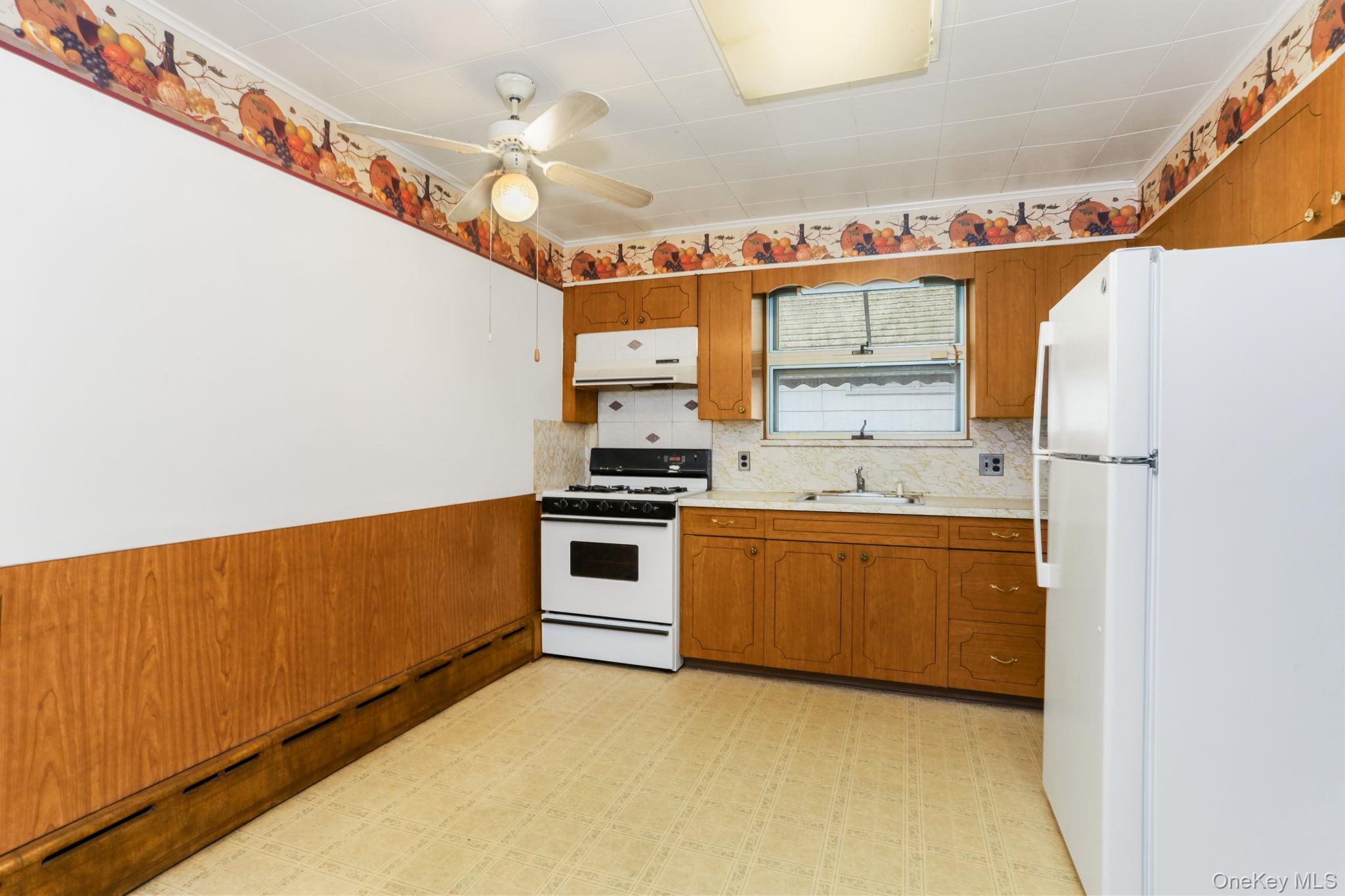 3 Hill Street New Rochelle, NY 10801 - Photo 12 of 46 a kitchen with granite countertop a sink and cabinets