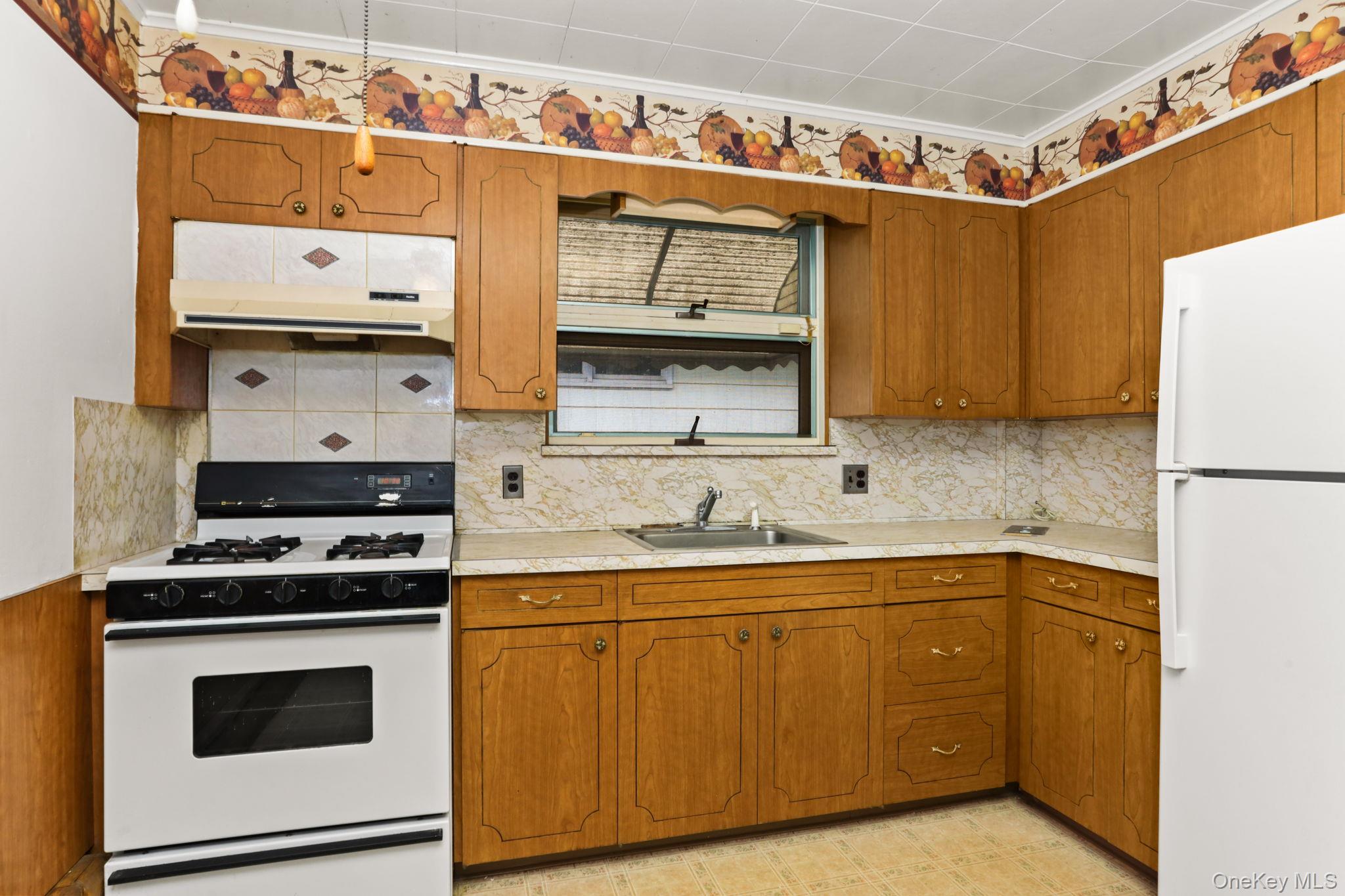 3 Hill Street New Rochelle, NY 10801 - Photo 14 of 46 a kitchen with cabinets appliances and wooden floor