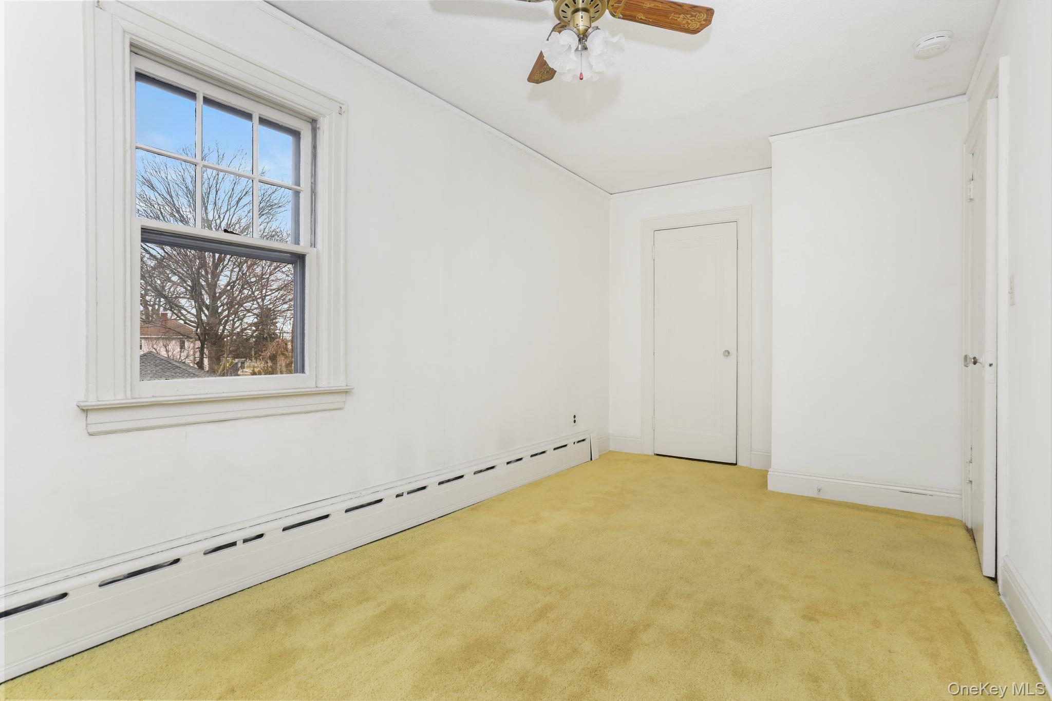 3 Hill Street New Rochelle, NY 10801 - Photo 29 of 46 a view of room with window and ceiling fan