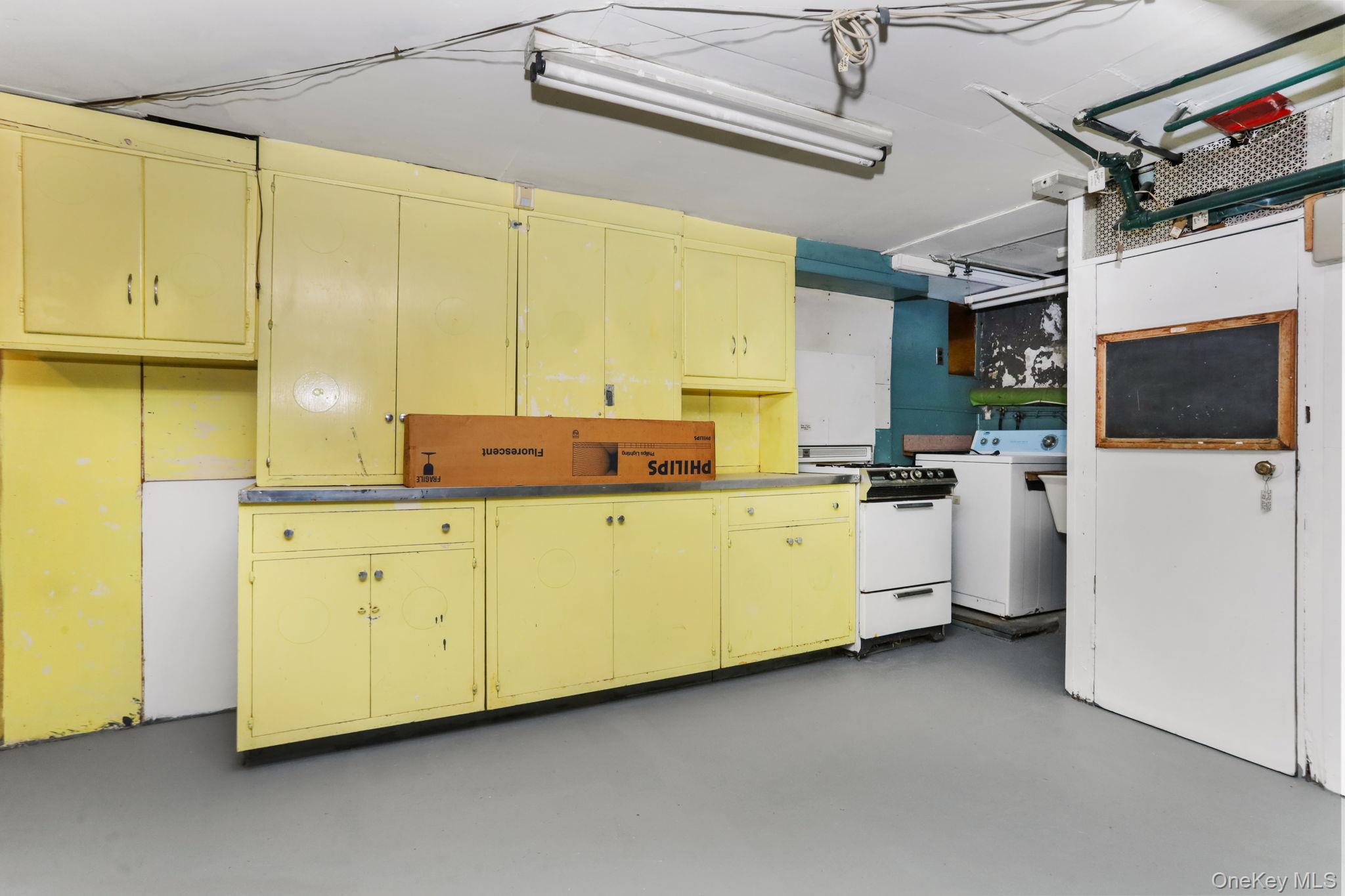 3 Hill Street New Rochelle, NY 10801 - Photo 32 of 46 a utility room with cabinets washer and dryer