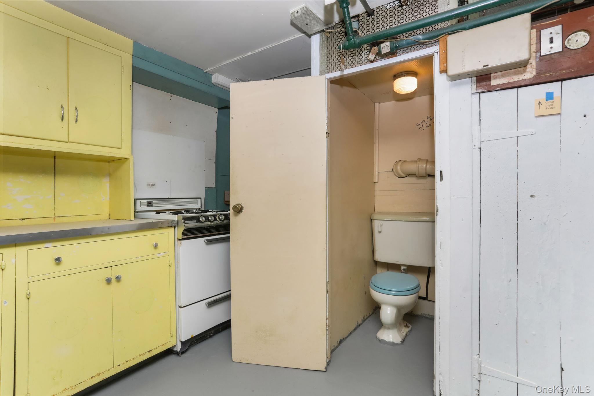 3 Hill Street New Rochelle, NY 10801 - Photo 33 of 46 a bathroom with a granite countertop sink mirror and toilet