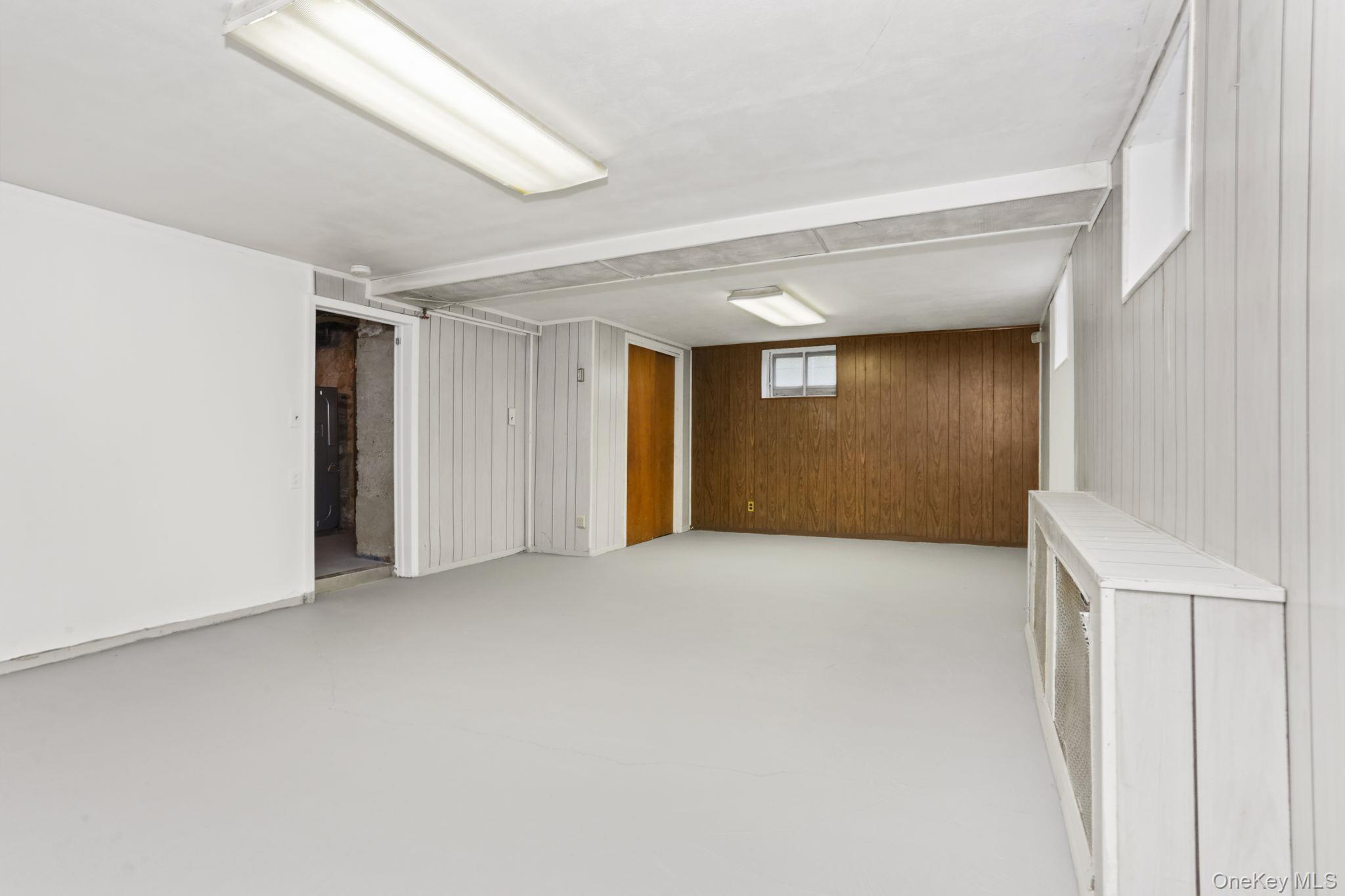 3 Hill Street New Rochelle, NY 10801 - Photo 34 of 46 a view of an empty room with a window