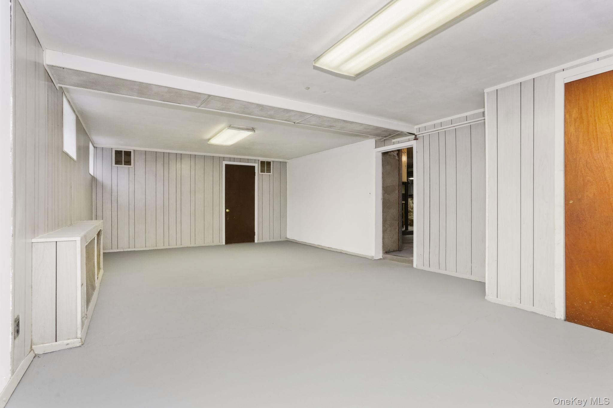 3 Hill Street New Rochelle, NY 10801 - Photo 36 of 46 a view of an empty room and a window