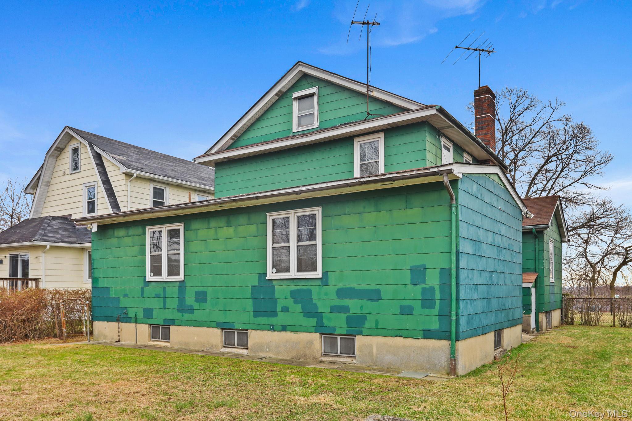 3 Hill Street New Rochelle, NY 10801 - Photo 41 of 46 a front view of a house with a yard