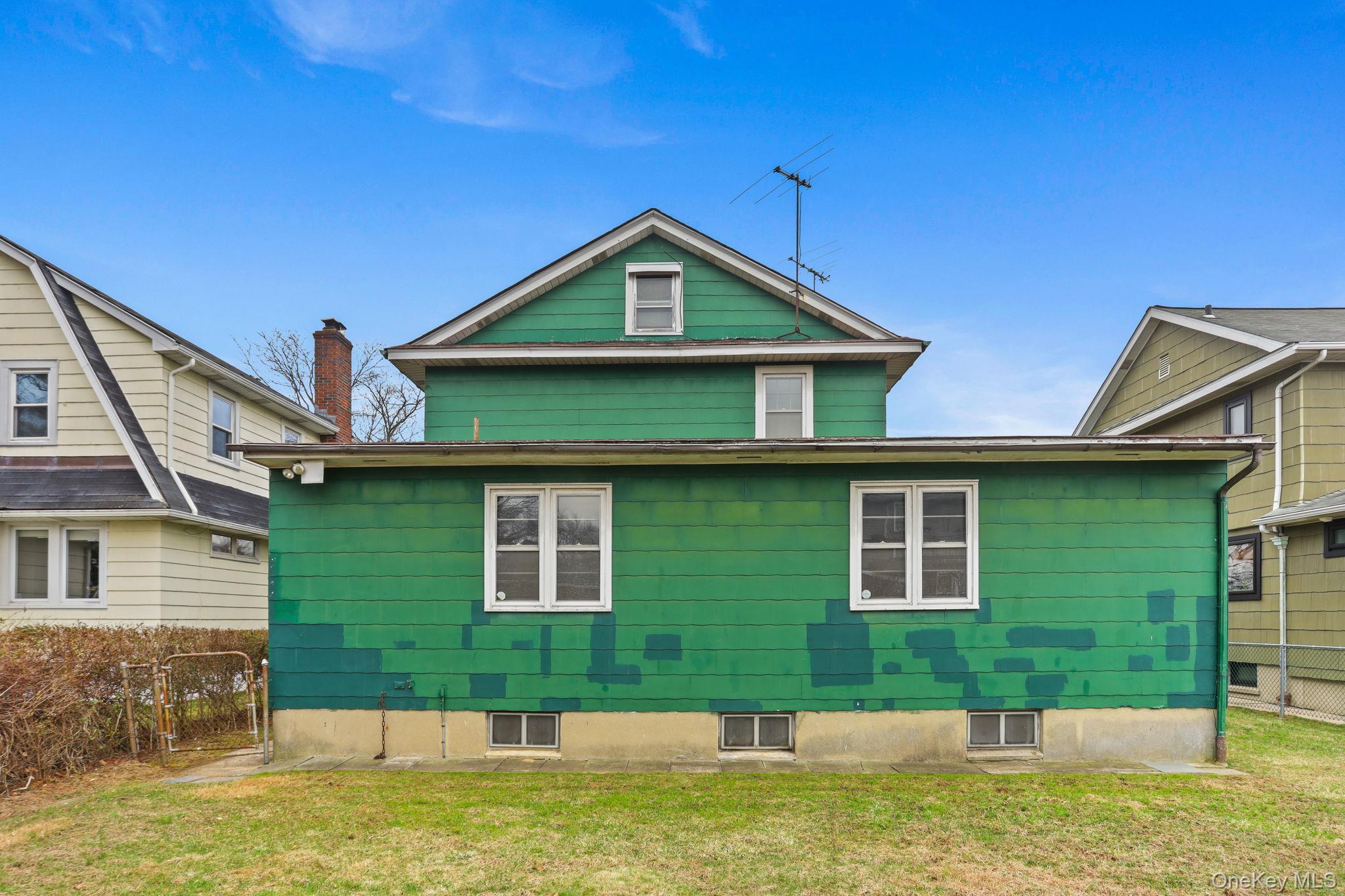 3 Hill Street New Rochelle, NY 10801 - Photo 45 of 46 a front view of a house with a yard
