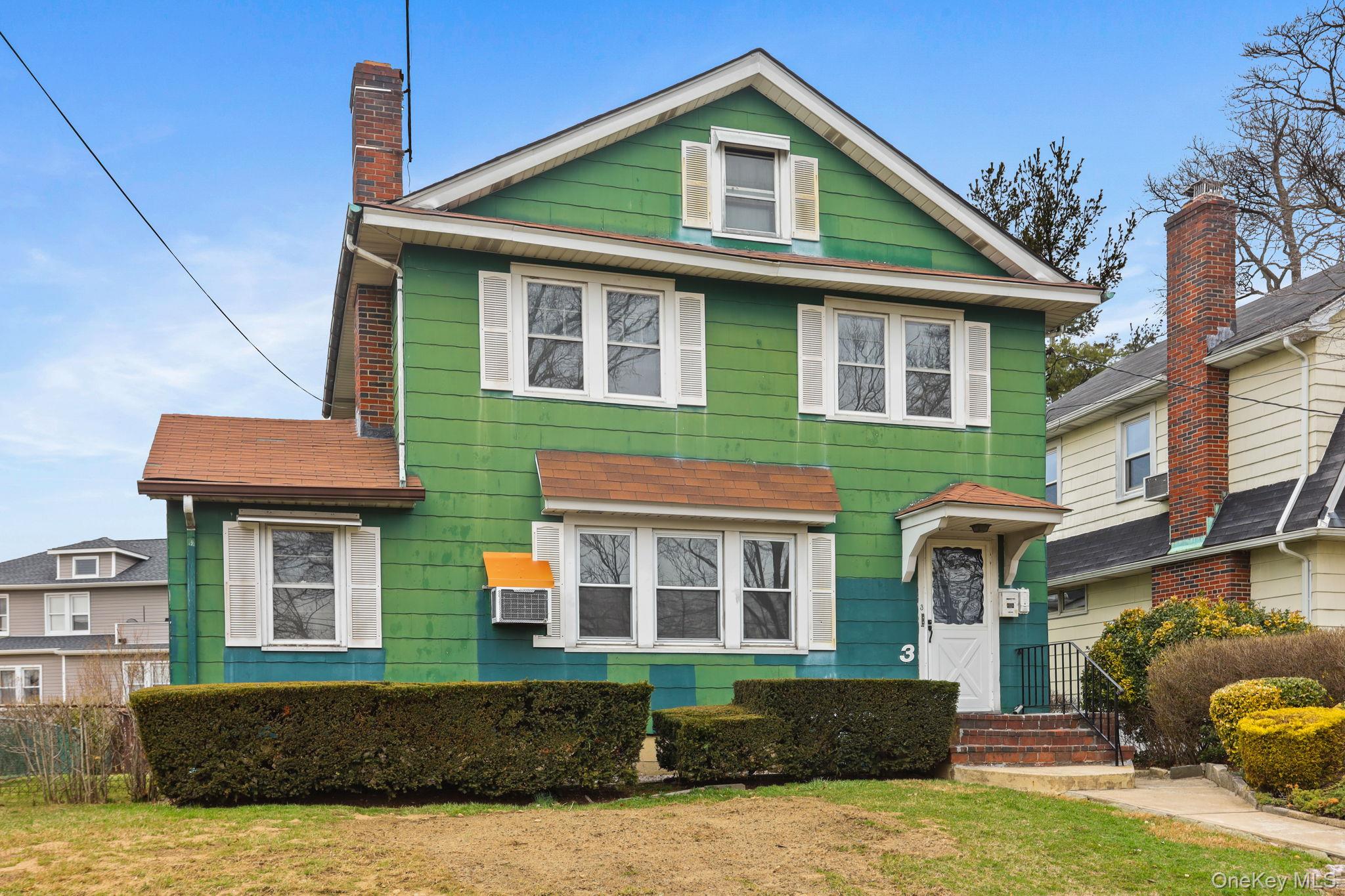 3 Hill Street New Rochelle, NY 10801 - Photo 46 of 46 a front view of a house with garden