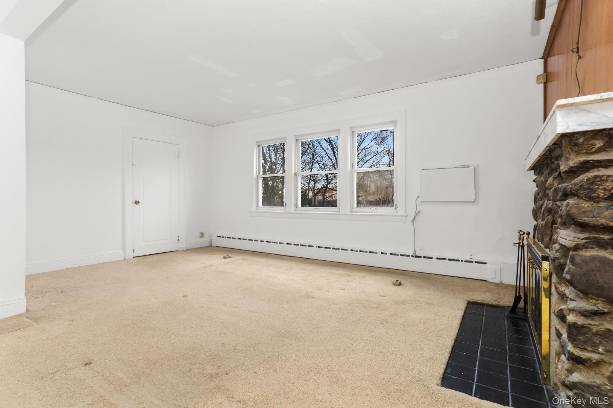 3 Hill Street New Rochelle, NY 10801 - Photo 8 of 46 a view of an empty room with a window