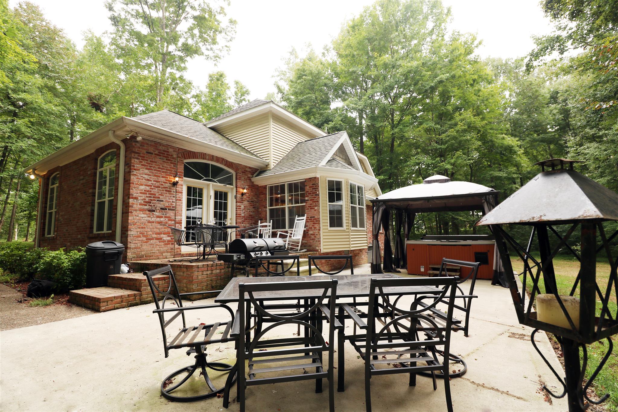 1240 Johnny Hall Road Burns, TN 37029 - Photo 14 of 15 beautiful tiered concrete patio with plenty of room for outdoor entertainment.