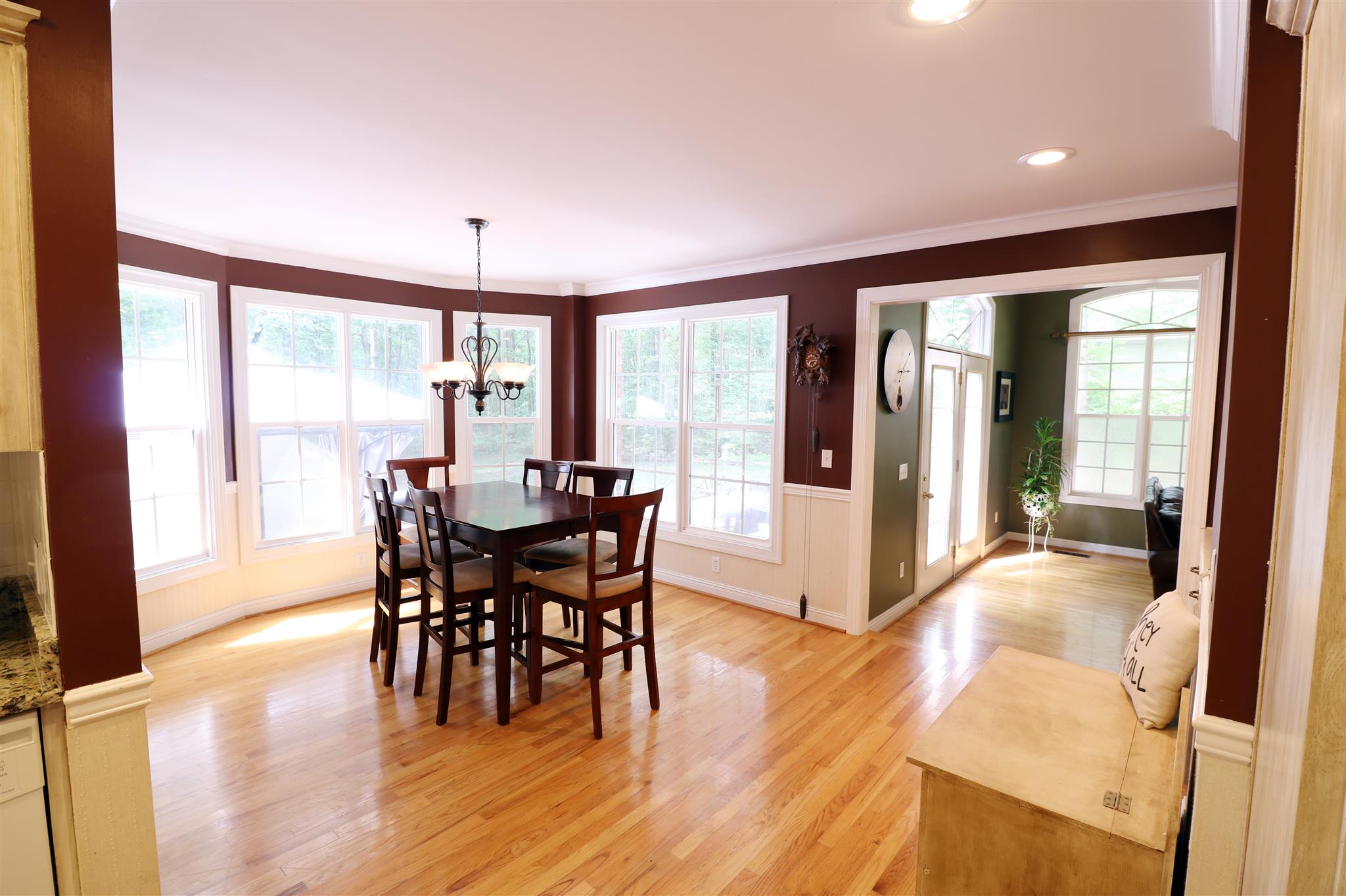 1240 Johnny Hall Road Burns, TN 37029 - Photo 3 of 15 Open kitchen and dining area with bay window and hardwood flooring.