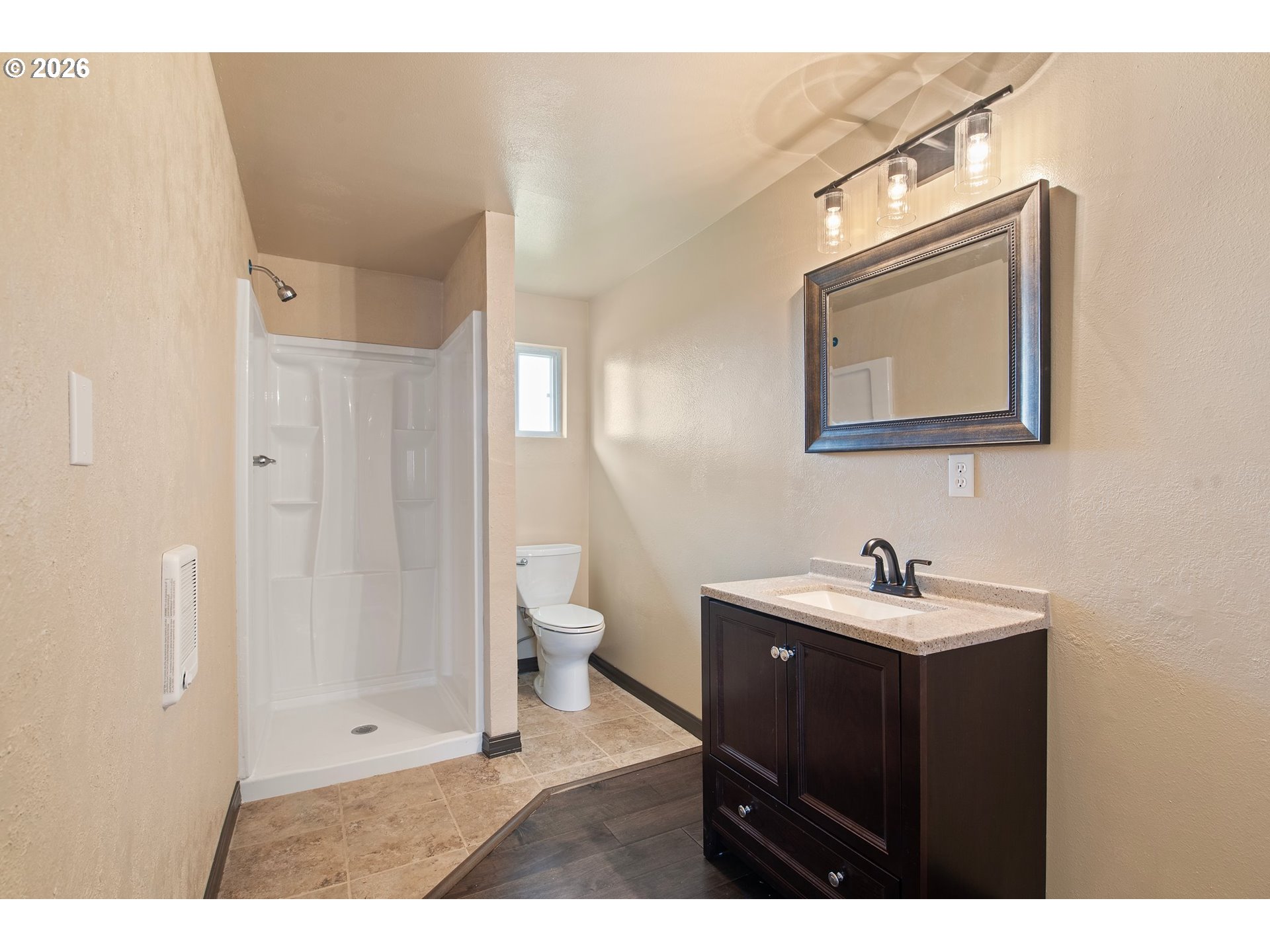 58015 Godley Road Union, OR 97883 - Photo 19 of 44 a bathroom with a sink and mirror with toilet