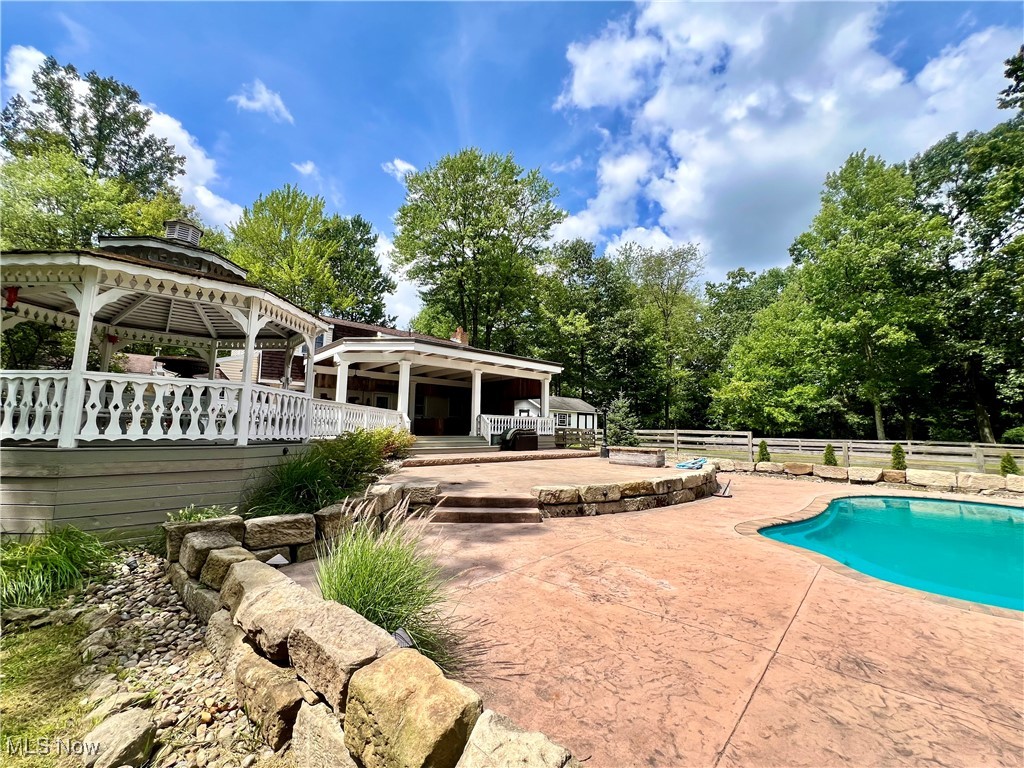 3840 Tabor Ridge Road Northeast Mineral City, OH 44656 - Photo 5 of 40 View of pool featuring a patio area and a gazebo