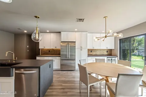 a view of a dining room with furniture window and outside view