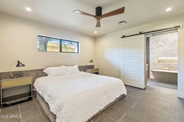 a spacious bathroom with a double vanity sink and a mirror