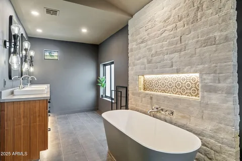 a white bath tub sitting in a bathroom