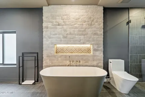 a bathroom with a toilet sink and shower