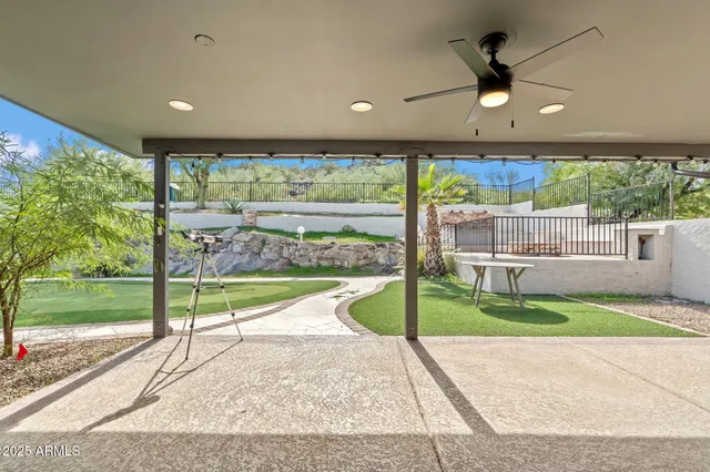 a view of a house with a swimming pool and a yard