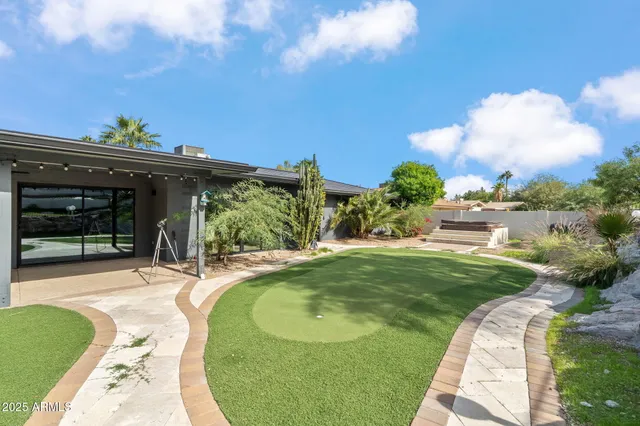 a bedroom with a bed and a mirror