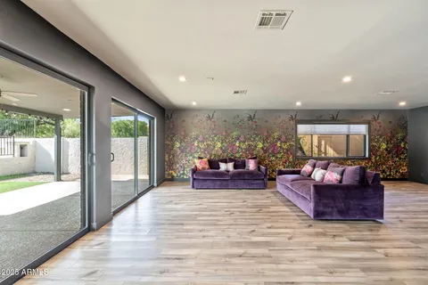 a kitchen with lots of counter top space and living room view