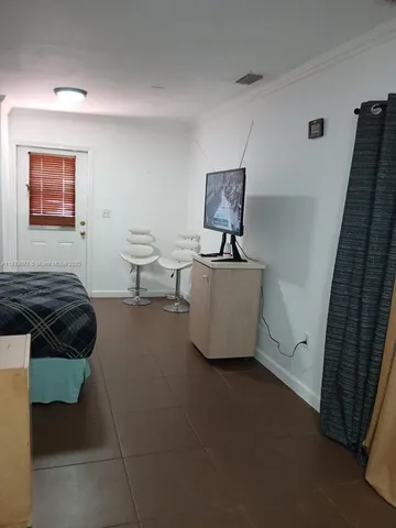 a living room with a couch and a flat screen tv