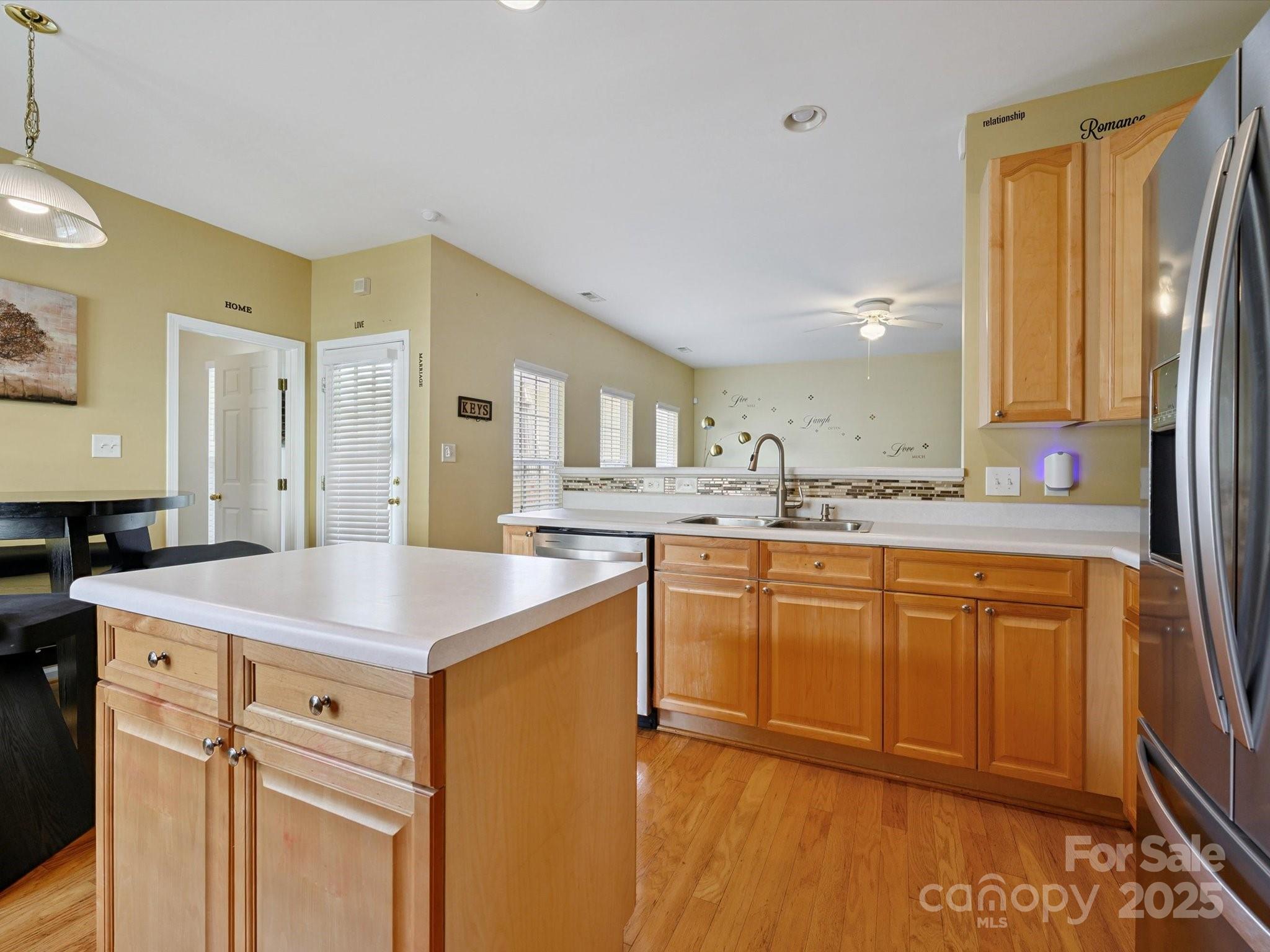 4959 Prosperity Ridge Road Charlotte, NC 28269 - Photo 12 of 40 a kitchen with stainless steel appliances granite countertop a sink stove and refrigerator