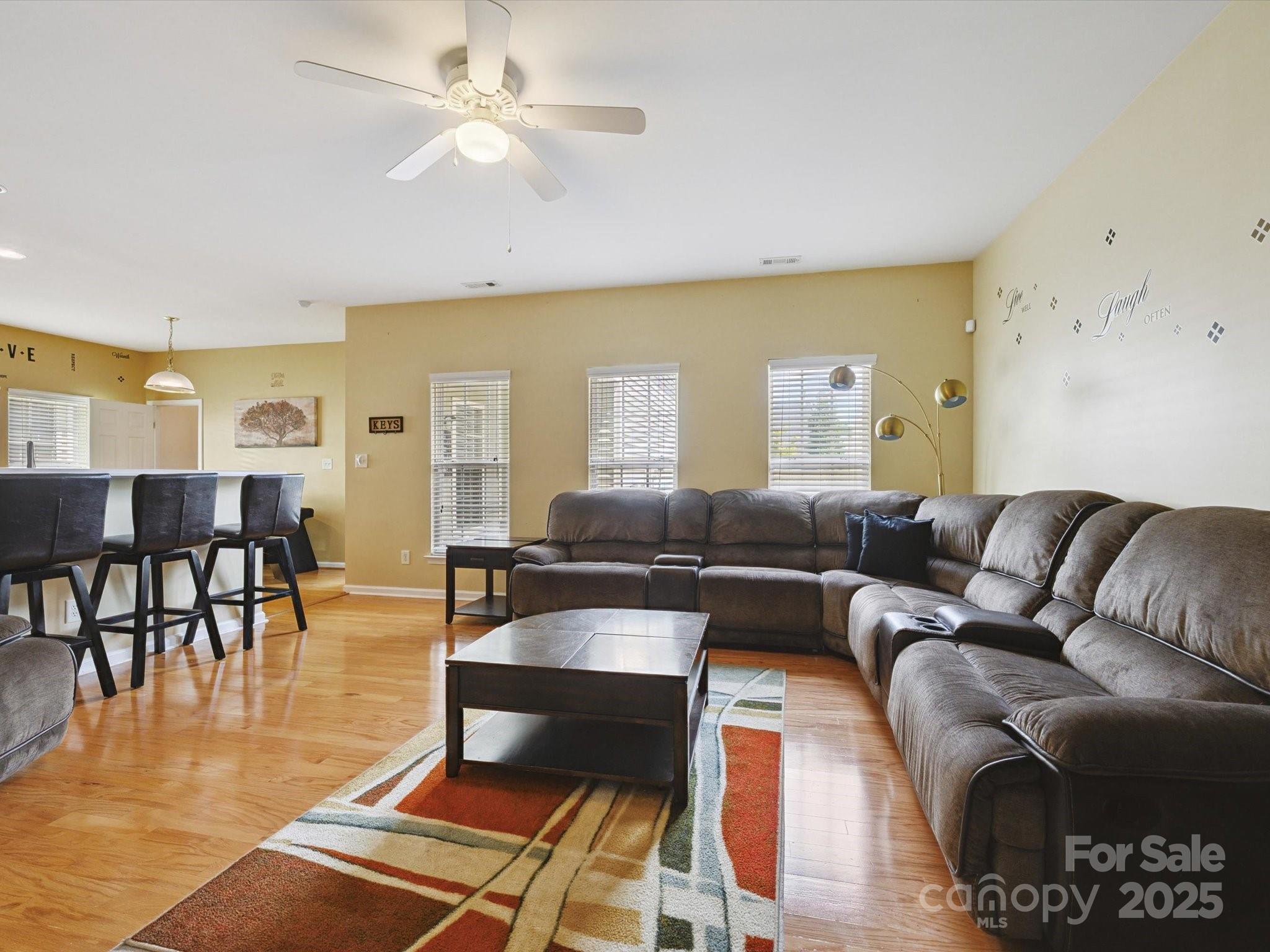 4959 Prosperity Ridge Road Charlotte, NC 28269 - Photo 17 of 40 a living room with furniture a dining table and a piano