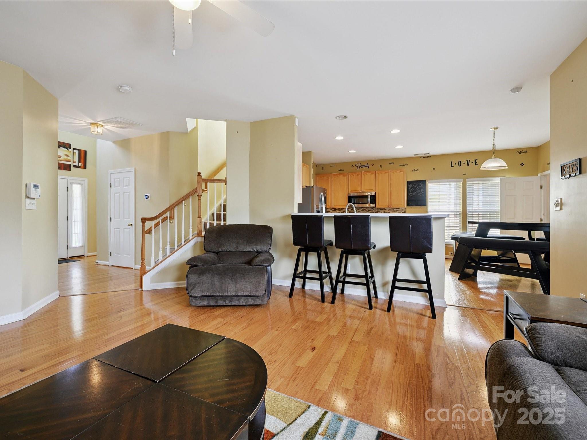 4959 Prosperity Ridge Road Charlotte, NC 28269 - Photo 18 of 40 a dining room with furniture and wooden floor