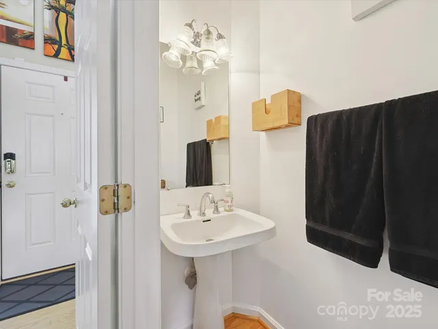 a bathroom with a sink a mirror and shower view
