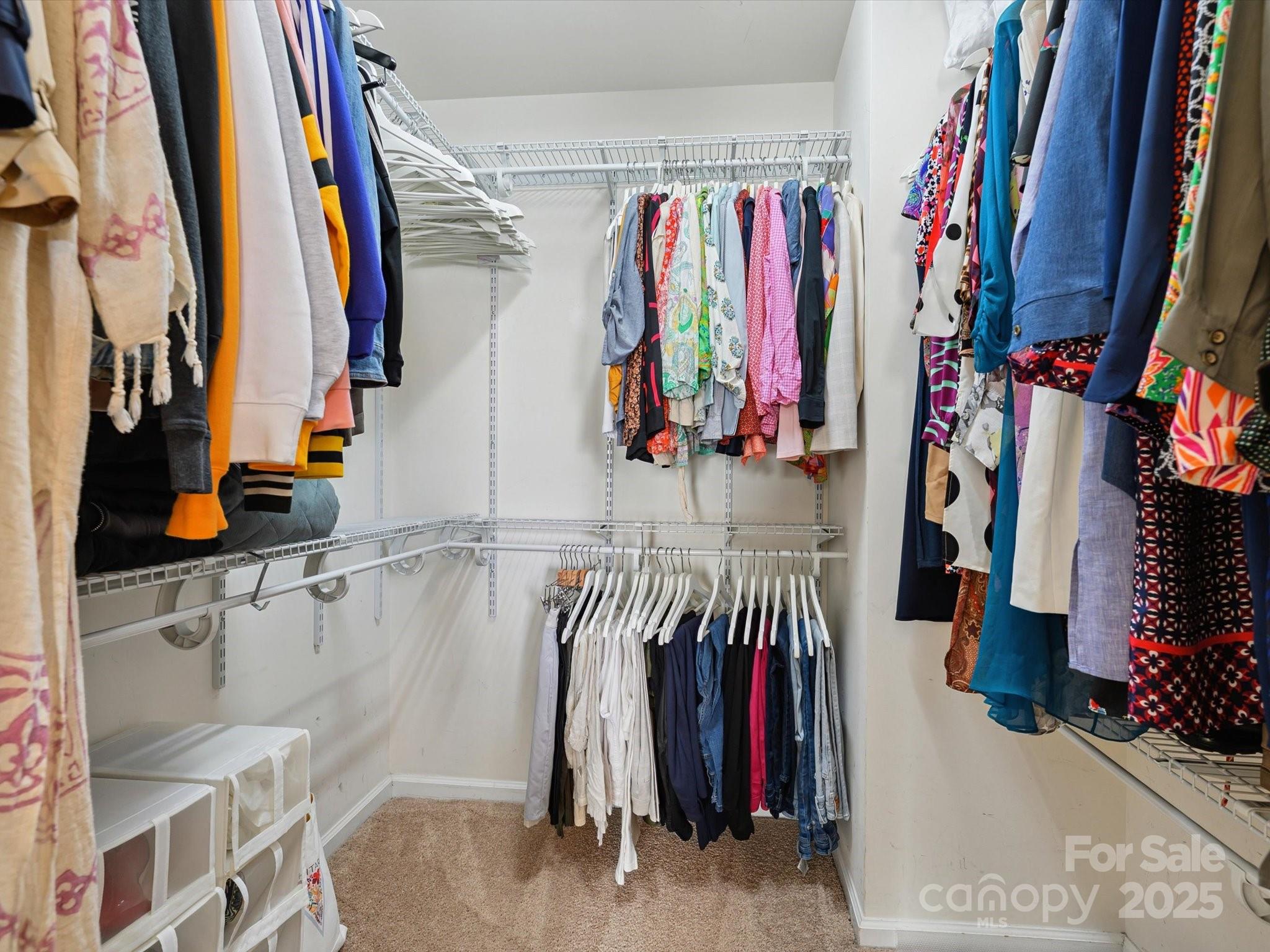4959 Prosperity Ridge Road Charlotte, NC 28269 - Photo 29 of 40 a view of walk in closet with clothes and shoes