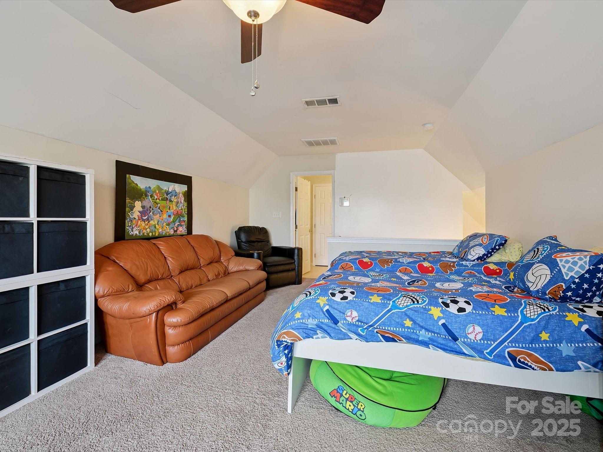 4959 Prosperity Ridge Road Charlotte, NC 28269 - Photo 31 of 40 a bedroom with a bed and a painting on the wall