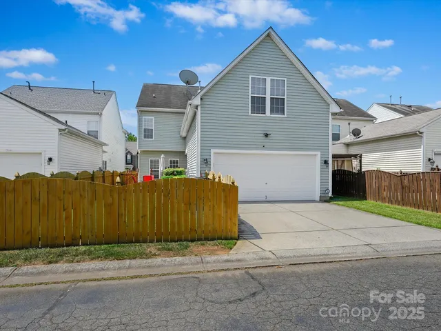 a view of a house with backyard and porch