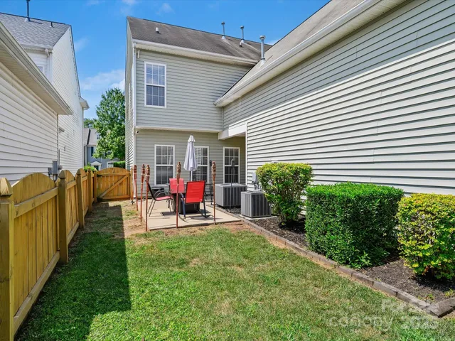a patio with a table and chairs