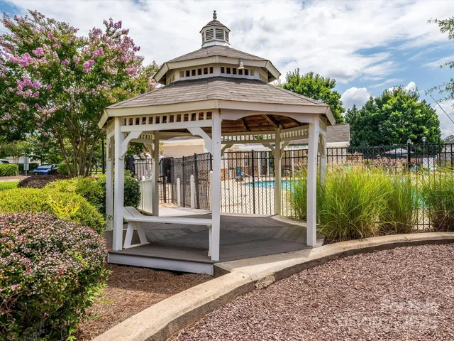 a view of big yard and front view of a house