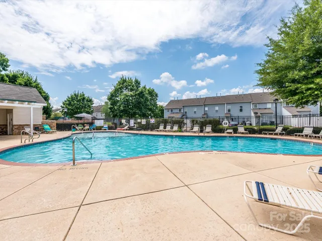 a view of a swimming pool with a lounge chairs