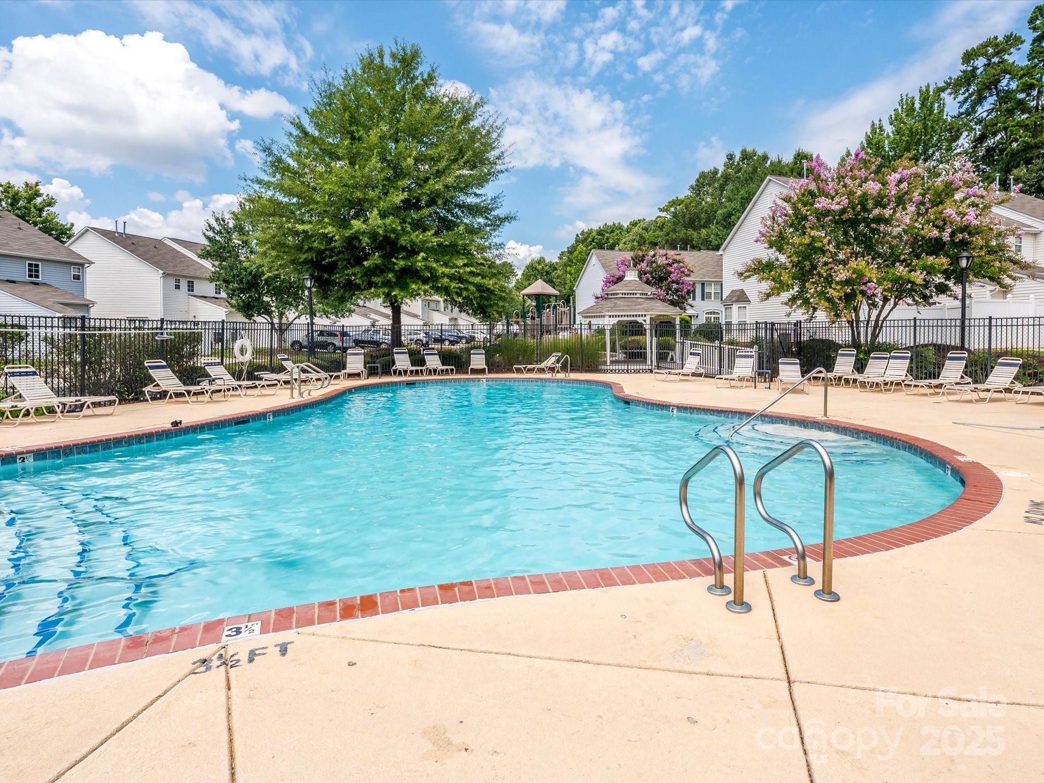 4959 Prosperity Ridge Road Charlotte, NC 28269 - Photo 40 of 40 a view of a swimming pool with a lounge chairs