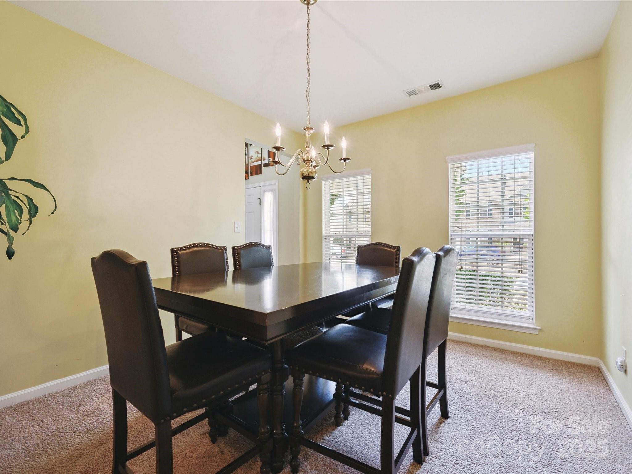 4959 Prosperity Ridge Road Charlotte, NC 28269 - Photo 8 of 40 a dining room with furniture and window