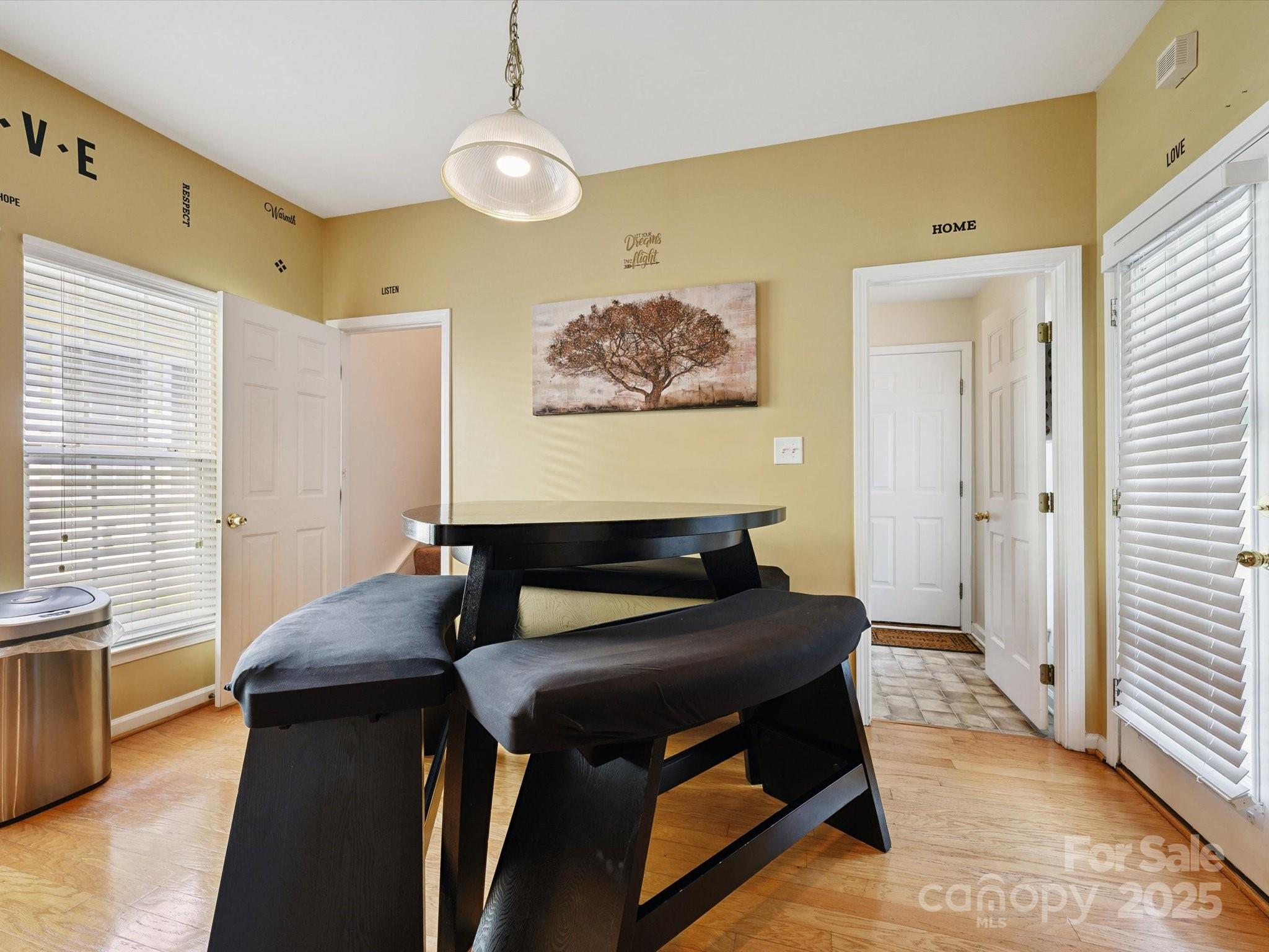 4959 Prosperity Ridge Road Charlotte, NC 28269 - Photo 9 of 40 a bedroom with a bed and wooden floor