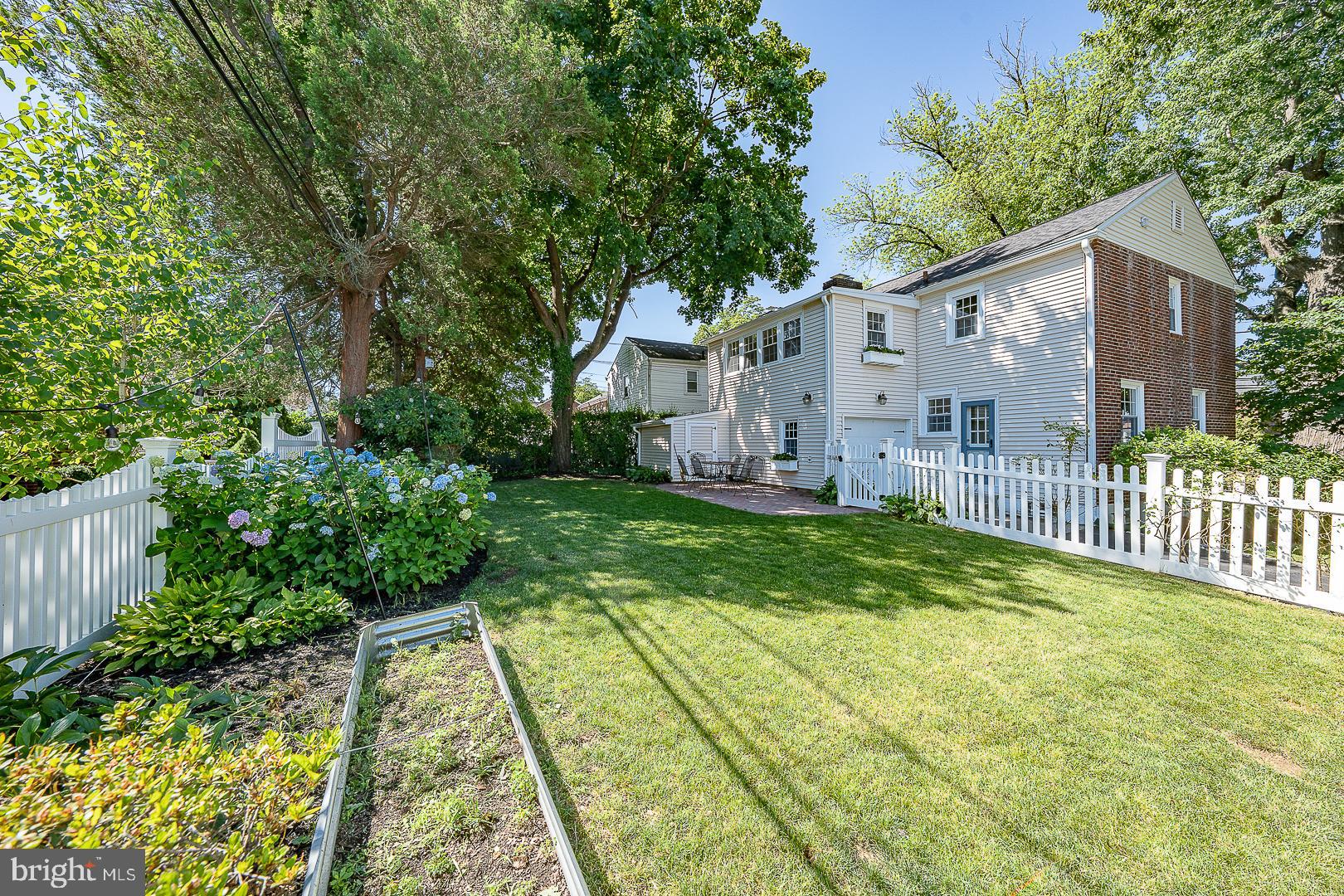 321 Earlington Road Havertown, PA 19083 - Photo 38 of 40 Sunny yard with flowering bushes