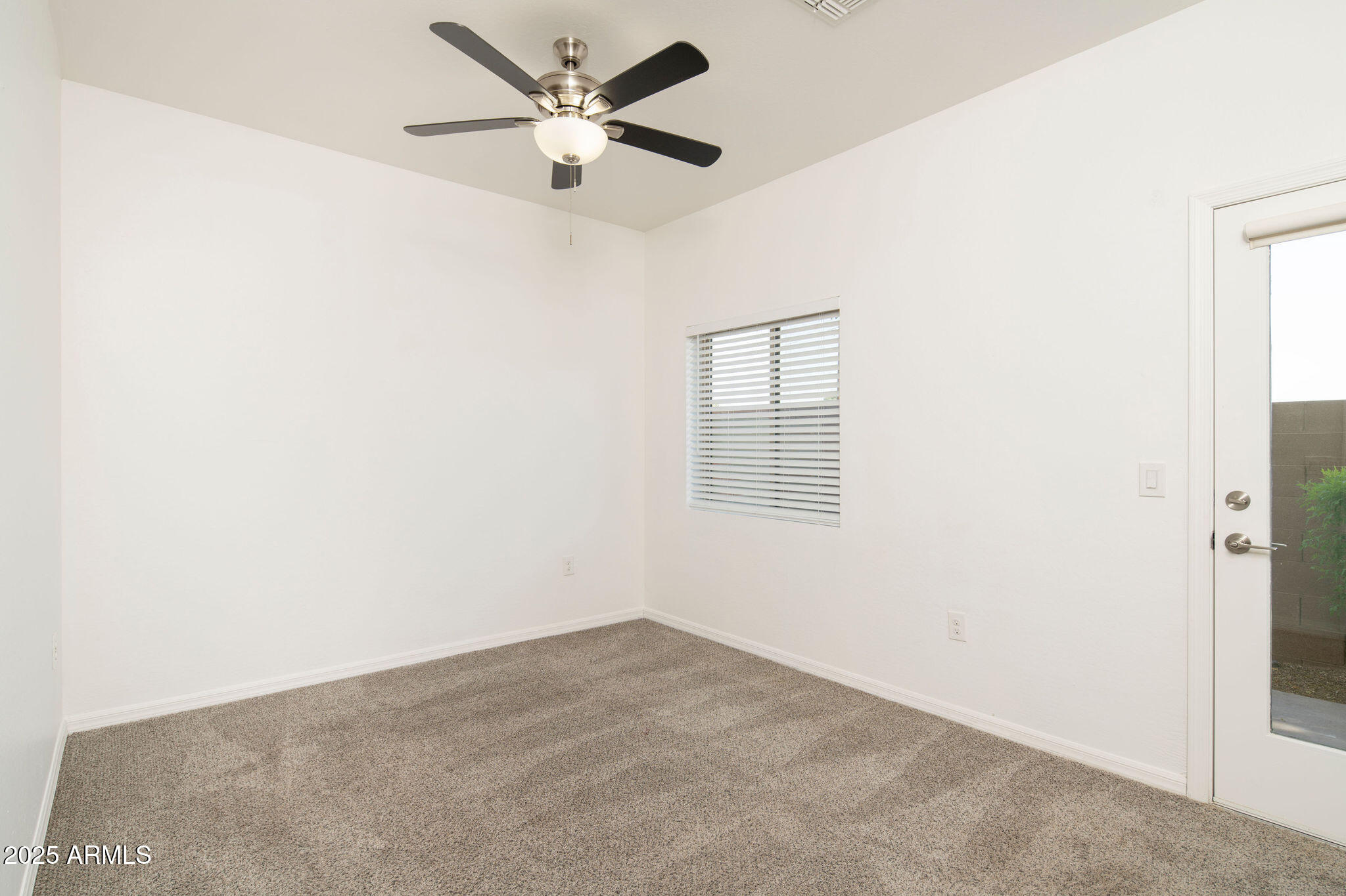 2016 West Orangewood Avenue Phoenix, AZ 85021 - Photo 20 of 22 an empty room with a window and a fan