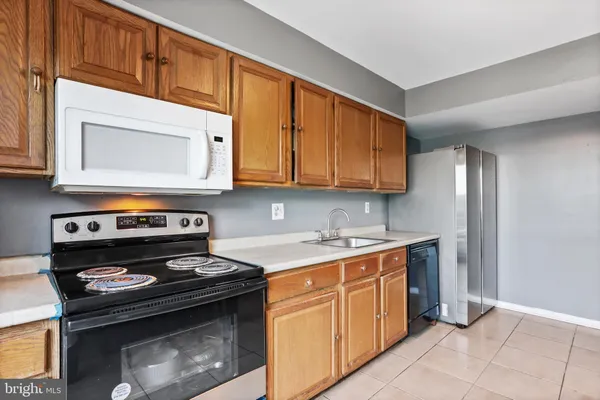 a kitchen with a stove and a microwave