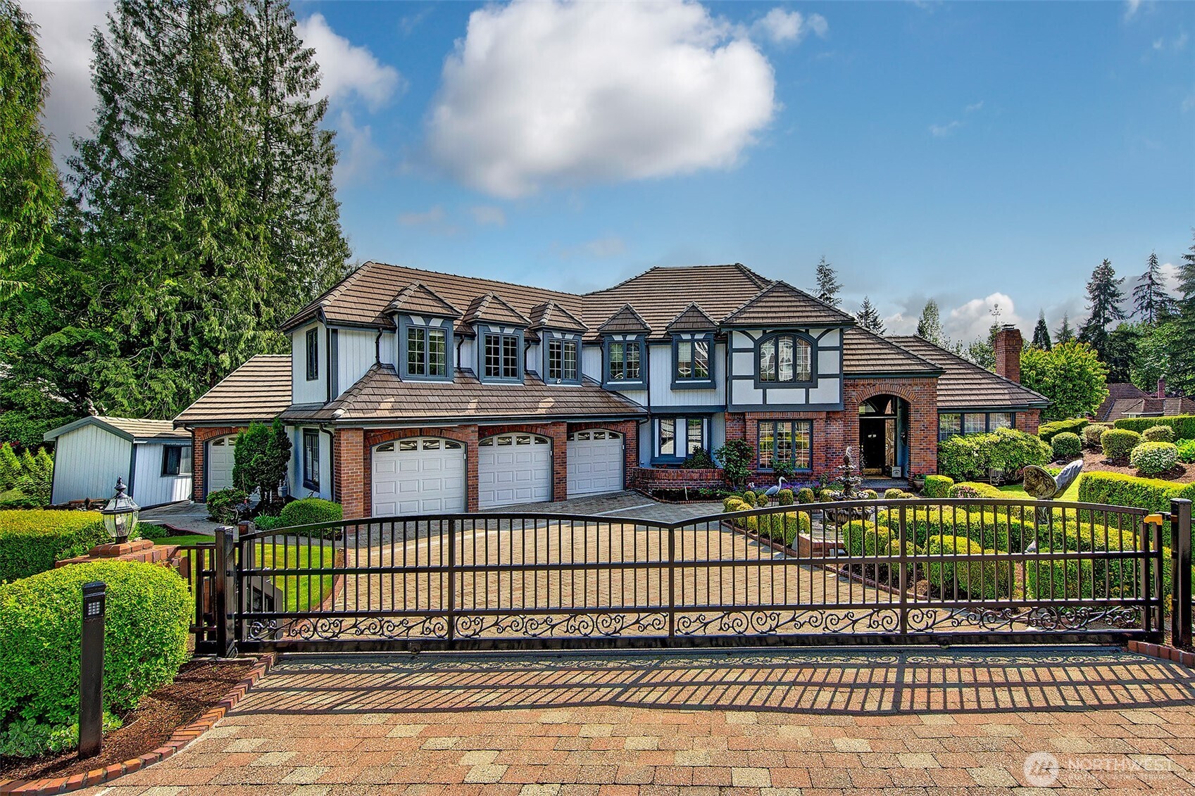 21031 49th Avenue Southeast Bothell, WA 98021 - Photo 1 of 40 a front view of a house with a garden