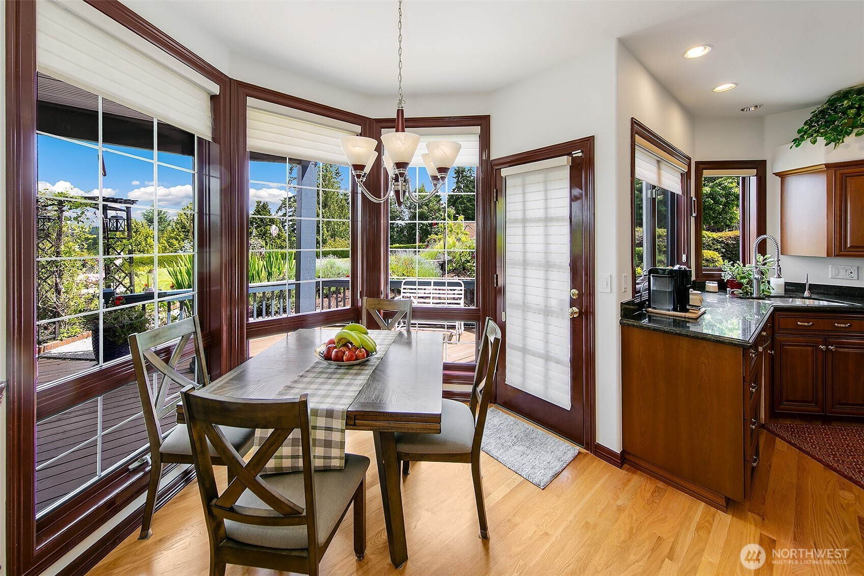21031 49th Avenue Southeast Bothell, WA 98021 - Photo 12 of 40 a view of a dining room with furniture window and outside view