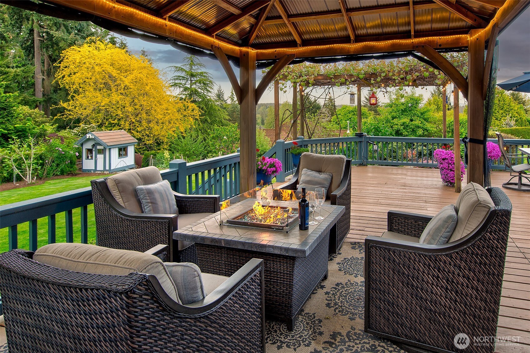 21031 49th Avenue Southeast Bothell, WA 98021 - Photo 30 of 40 a roof deck with table and chairs and wooden floor
