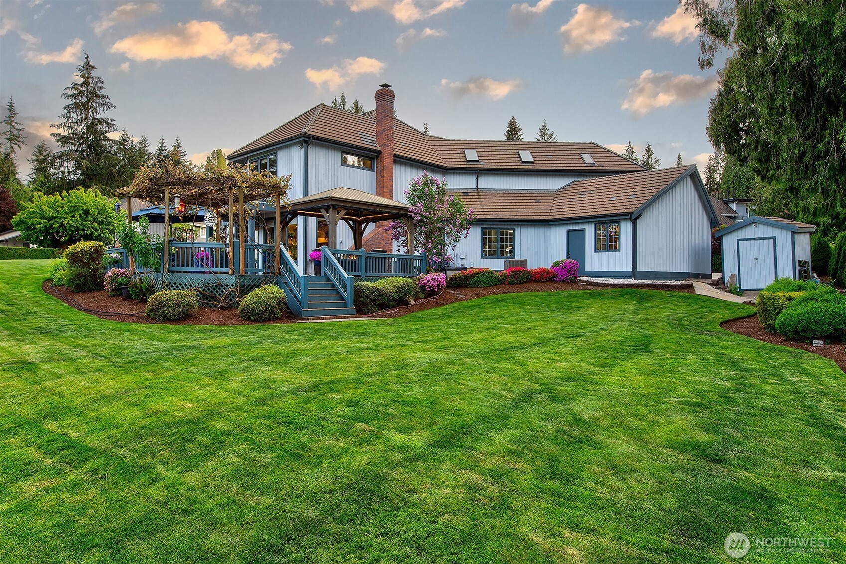 21031 49th Avenue Southeast Bothell, WA 98021 - Photo 32 of 40 a view of a house with a big yard and potted plants