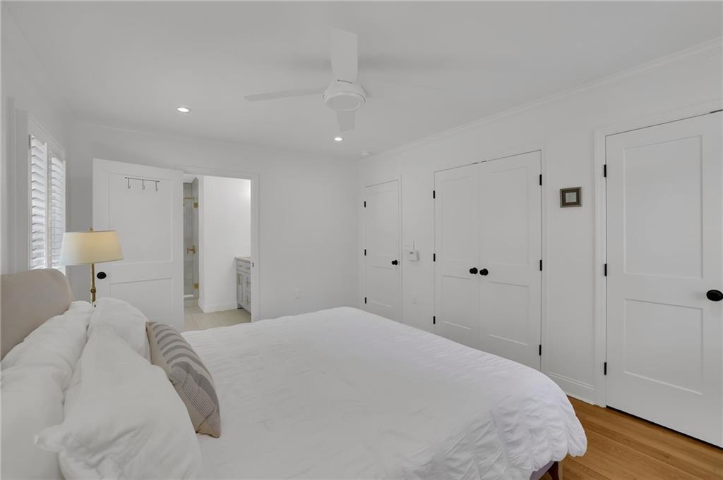 2602 Tanglewood Road Decatur, GA 30033 - Photo 19 of 37 a spacious bedroom with a bed and a lamp