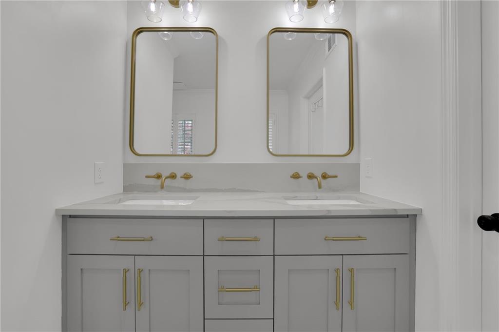 2602 Tanglewood Road Decatur, GA 30033 - Photo 23 of 37 a bathroom with double vanity sinks and a mirror