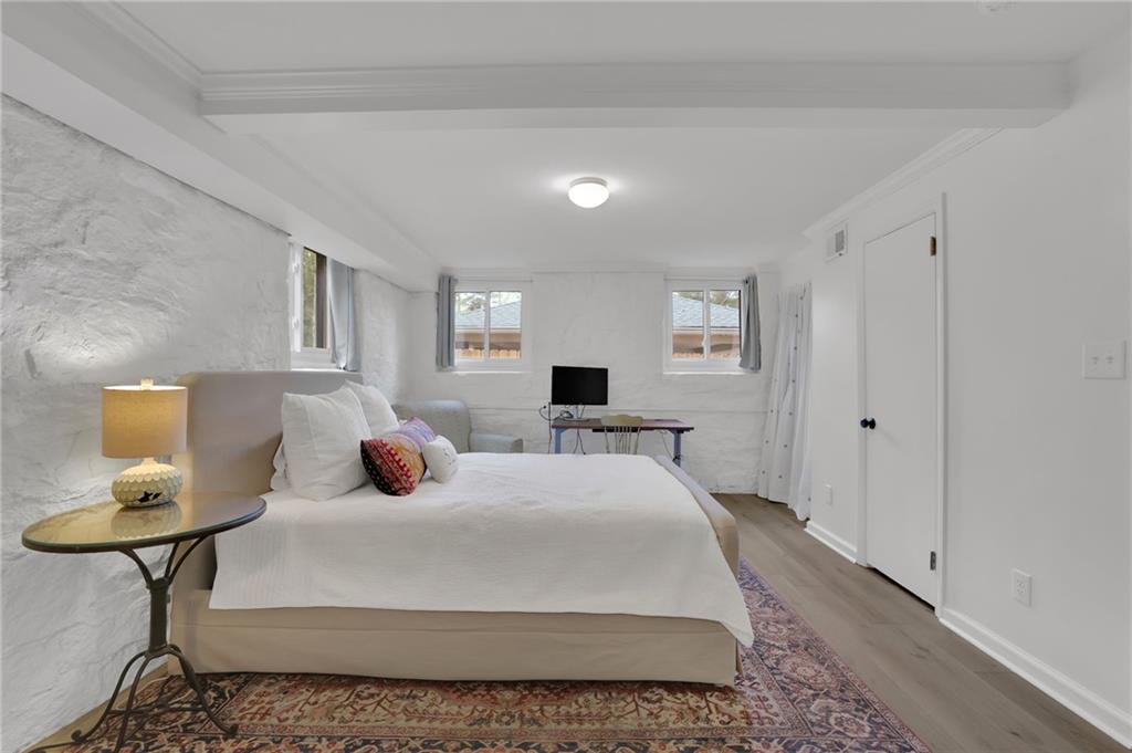 2602 Tanglewood Road Decatur, GA 30033 - Photo 29 of 37 a bedroom with a bed and a lamp