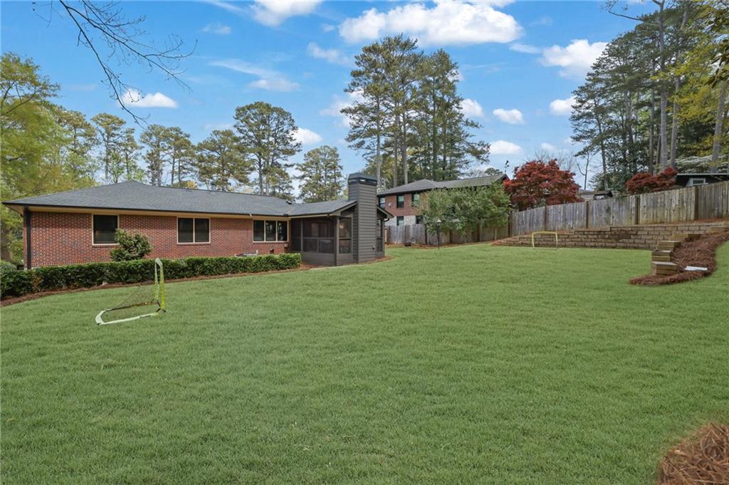 2602 Tanglewood Road Decatur, GA 30033 - Photo 35 of 37 a front view of a house with garden