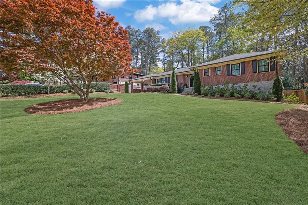2602 Tanglewood Road Decatur, GA 30033 - Photo 4 of 37 a front view of a house with garden